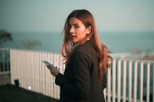 woman walking with phone